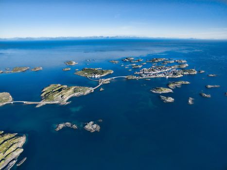 Aerial view of picturesque fishing port Henningsvaer on small islands in the sea