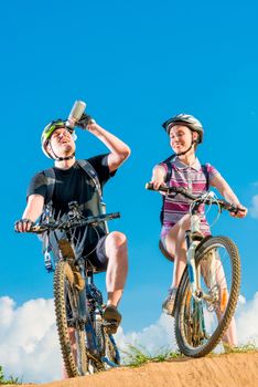 thirsty man and his wife on bicycles