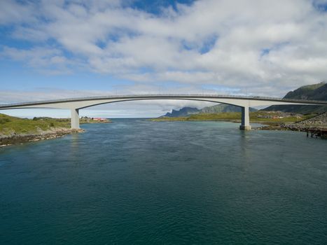 Modern bridge spanning narrow fjord in Norway