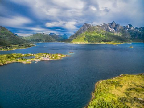Picturesque aerial view of fjord with Sildpollnes Church on Lofoten islands in Norway