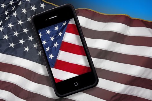 The national flag of the United States of America and Smartphone.  The 50 stars represent the 50 states and the 13 stripes represent the thirteen British colonies that declared independence from Great Britain to become the first states in the Union.