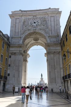 LISBON, PORTUGAL - SEPTEMBER 26, 2015: unidentified people walking at Rua Augusta arch in  Lisbon on September 26, 2015. Lisbon is a capital and must famous city of Portugal