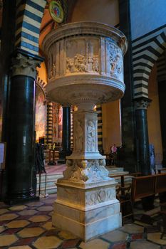 Prato,Italy,11 october 2015.Notable Renaissance pulpit in white marble (1469-1473). The base is decorated with sphinxes. The parapet has reliefs by Antonio Rossellino and by Mino da Fiesole. It is located in the Cathedral of Prato.