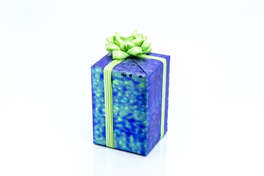 blue gift box with green ribbon bow, isolated on white