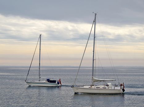 Sailing yacht boat sailing on the ocean sea with beautiful calm water  