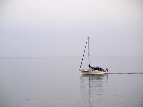 Sailing yacht boat sailing on the ocean sea with beautiful calm water