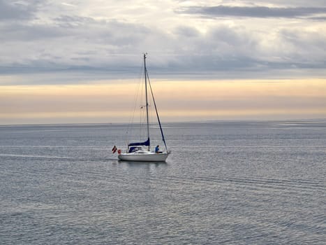 Sailing yacht boat sailing on the ocean sea with beautiful calm water