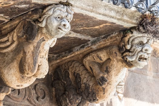 The detail of a baroque balcony in sicily