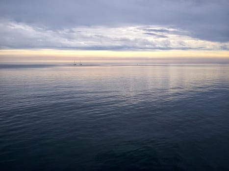 Sailing yacht boat sailing on the ocean sea with beautiful calm water