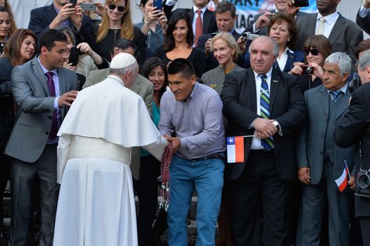 ITALY, Rome: Pope Francis shakes hands with devotees in St. Peter's Square at the Vatican on October 14, 2015. While addressing his weekly general audience there, the pope reportedly asks forgiveness for a pair of scandals within the Vatican this month: Monsignor Krzysztof Charamsa was recently dismissed after revealing at an October 3 news conference that he was gay and had lived with his male partner for years. And a clergyman at the Santa Teresa d'Avila parish reportedly had relations with vulnerable adults, according to local media.