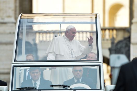 ITALY, Rome: Pope Francis waves to a crowd in St. Peter's Square at the Vatican on October 14, 2015. While addressing his weekly general audience there, the pope reportedly asks forgiveness for a pair of scandals within the Vatican this month: Monsignor Krzysztof Charamsa was recently dismissed after revealing at an October 3 news conference that he was gay and had lived with his male partner for years. And a clergyman at the Santa Teresa d'Avila parish reportedly had relations with vulnerable adults, according to local media.