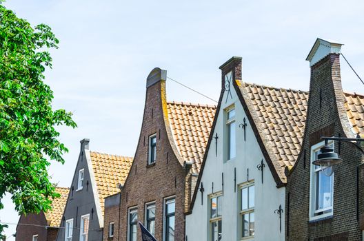 Cityscape of various Dutch building facades.