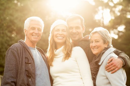 Portraitr of a smiling family on an autumns day