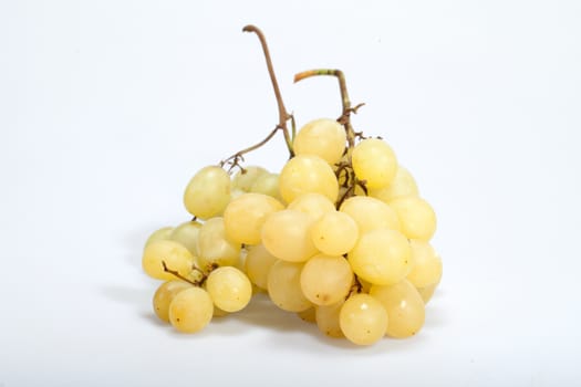 Sweet and ripe white grapes isolated on white