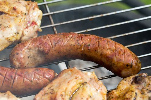 barbecue with delicious grilled meat on grill 