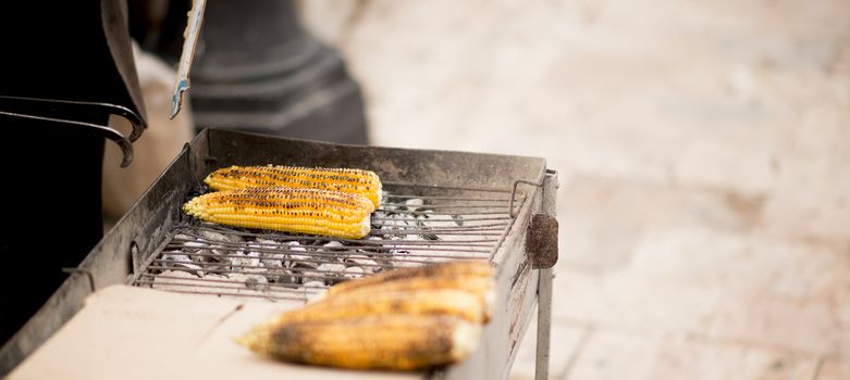 Picture of a Street vendor sells  grilled corn