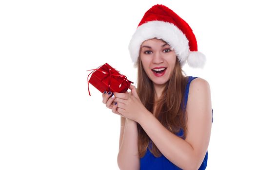 girl in a Christmas cap gift to rejoice on white background.