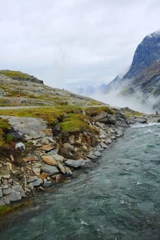 Beautiful mountain glacial river in high Norway mountains