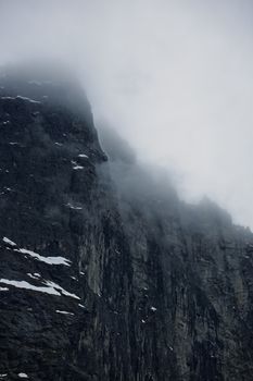 The Troll Wall in Norway, magestic summer foggy mountains