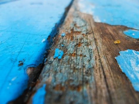 old blue painted wooden table surface decaying texture or wallpaper