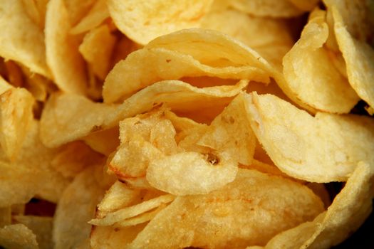 background of potato chips or crips extremely close up