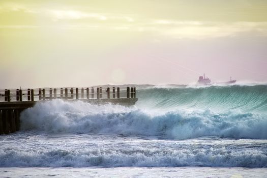 Huge Wave During high tide headinginto Durban Pier and Ship Struggling in the background in the rough seas