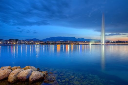 Geneva panorama with famous fountain by night, Switzerland, HDR