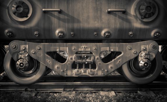 Industrial rail train wheels closeup technology black and white photo