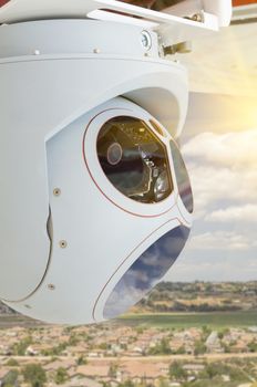 Closeup of A Drone Wing Camera and Sensor Pod Module Above A Residential Neighborhood.