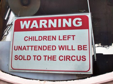 Unattended children will be sold to the circus - funny sign