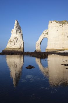 Etretat Aval cliff and blue ocean. Normandy, France, Europe.