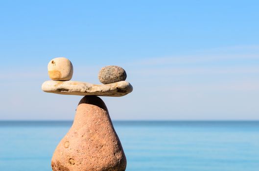 Balancing of stones each other on the seashore