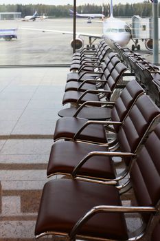 Chairs in a row at airport waiting room