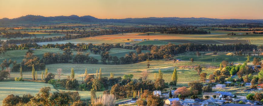 Sunlight across the frosty fields around  the Cowra district just after the first rays of sunlight burst forth from the ranges.