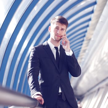 Businessman talking on the phone in modern building