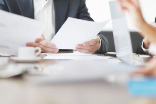 Close-up of Business people working together at a meeting