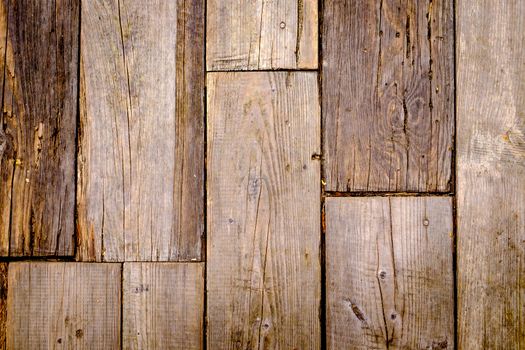 Close-up view of textured and weathered wooden tiles background