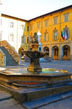 Prato,Italy,11 october 2015.The Fountain of Bacchino is one of the symbols of Prato and is located in the town square. The public fountain was built between 1659 and 1665 for the proclamation of Prato as "city" and the Diocese of 1653. The work of the sculptor Ferdinando Tacca, who created the bronze figure of a young Bacchus sitting around in bunches 'grape.