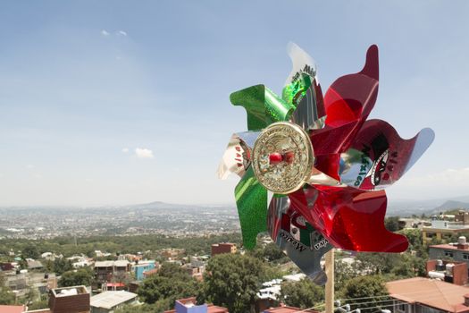 Mexican Rehilete memorial to September 15. Background can appreciate valley of Mexico and the blue sky with clouds