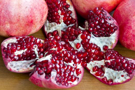 Photo of the dark red pomegranate is cut open