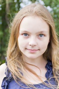 Portrait of cute girl with blond hair