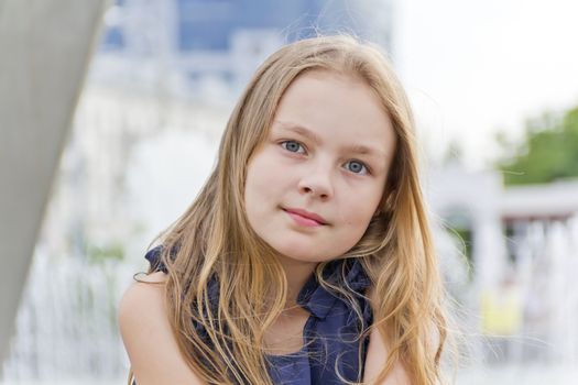 Portrait of cute girl with blond hair