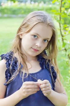 Cute girl with blond hair on green background