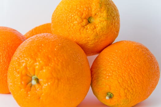 Photo of appetizing ripe oranges on white background