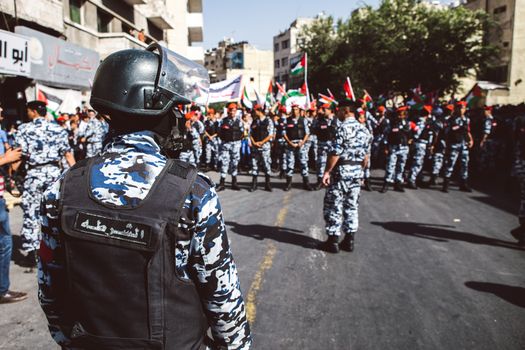 JORDAN, Ammam : Jordan police gather in line while around 5,000 people protest against Israeli violations against Palestinians  in the center of Ammam, capital city in Jordan on October 16, 2015. Demonstrators ask for the end of 1994 Israel-Palestine peace treaty. Since October 1st, 2015, tensions in border between Israel and the Gaza strip get higher. Seven Israelis have been killed in more than two dozen attacks by Palestinians this month, mostly in Jerusalem, and about 70 have been wounded. 