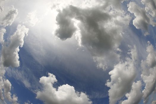 Image of the sky - bizarre clouds on the sky - fish eye lens view