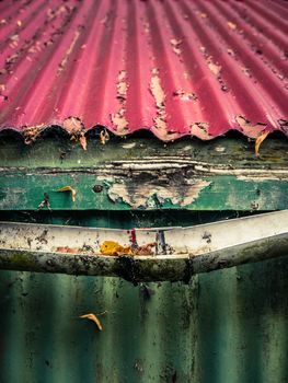 Broken Plastic Gutter On The Roof Of A House Or Farm Building