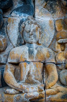 Sitting Buddha encarved in stone, found at Borobudur Indonesia, biggest buddhist temple in 