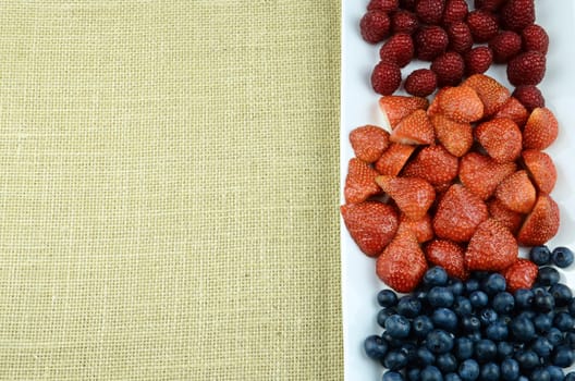 Raspberry, blueberry, strawberry fruits frame ready to add text