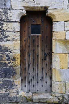 Old wooden door to a  Clifford's Tower in York

